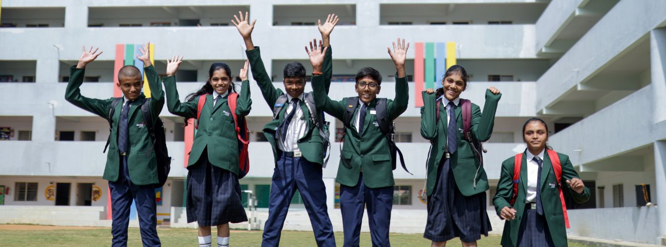 students-jumping-high-with-happy-faces